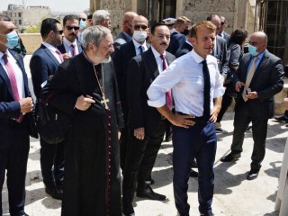 French President Emmanuel Macron (C-R) tours the Our Lady of the Hour Church in Iraq's second city of Mosul, in the northern Nineveh province, on August 29, 2021. (Photo by Zaid AL-OBEIDI / AFP) (Photo by ZAID AL-OBEIDI/AFP via Getty Images)